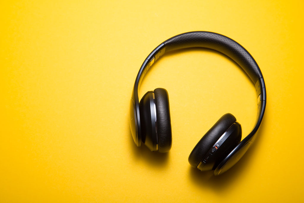 a picture of some headphones on a yellow background